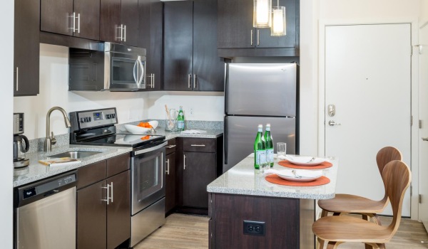 a kitchen with a table and chairs