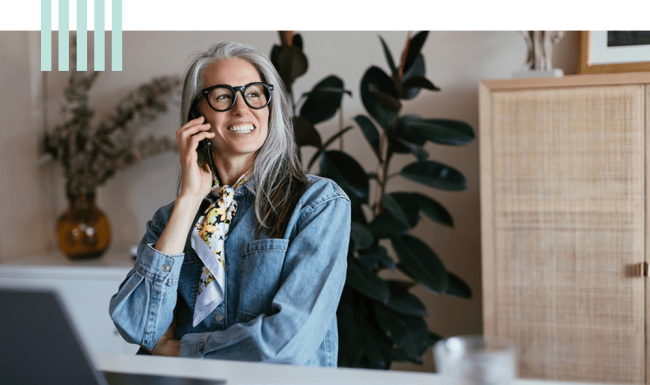 Woman sitting in her room on the phone
