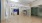 A well-lit fitness center with cardio and weight training  equipment